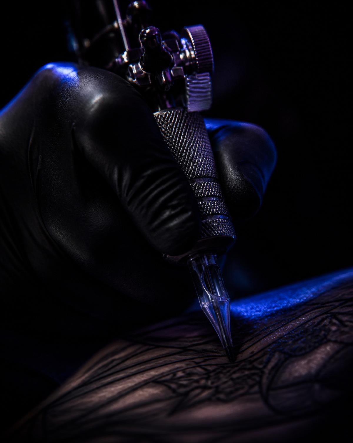 Tattoo artist working with a rotary machine